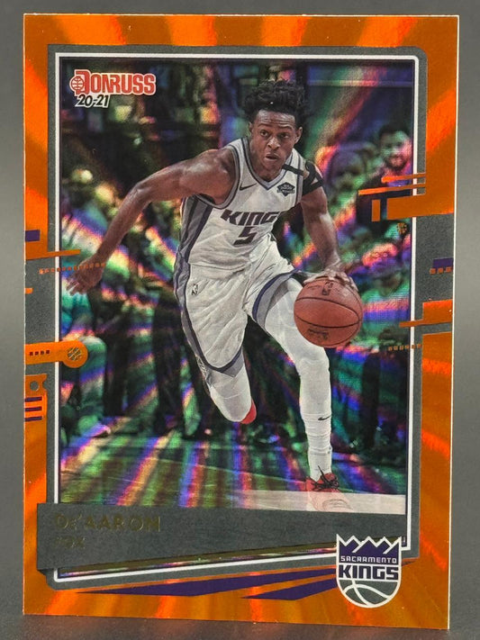 20-21 Donruss De'Aaron Fox Sacramento Kings basketball card with orange laser border.