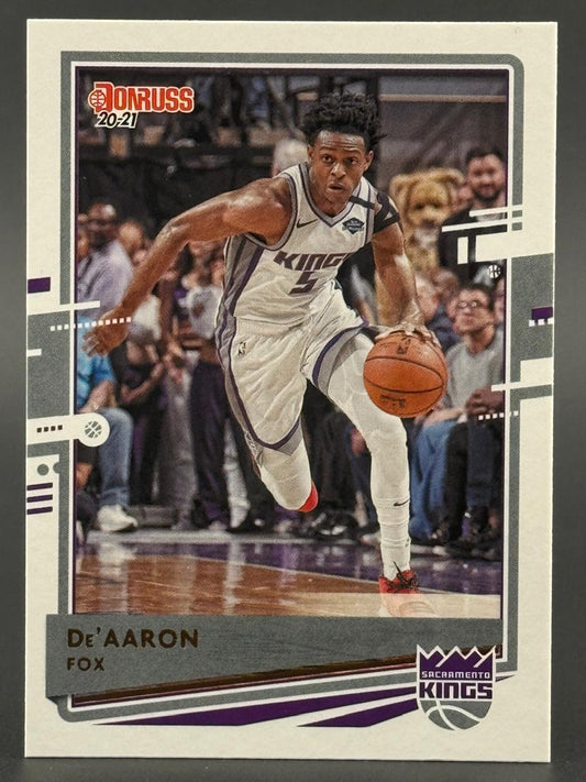 2020-21 Donruss De'Aaron Fox trading card showing him dribbling in a Sacramento Kings uniform.