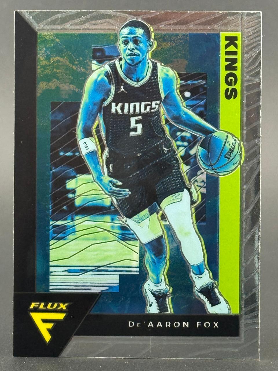 De'Aaron Fox 2021-22 Flux basketball card featuring him in a Kings uniform dribbling.