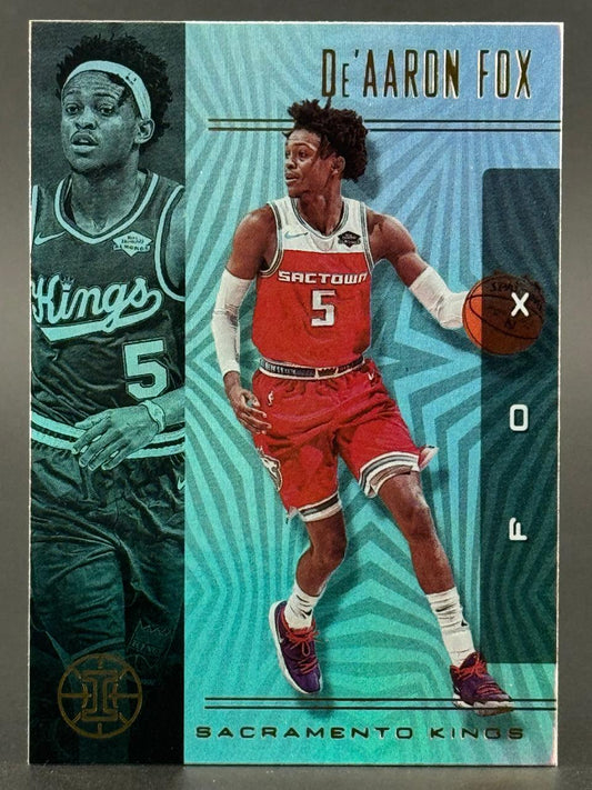 De'Aaron Fox Sacramento Kings trading card with blue and green patterned background.