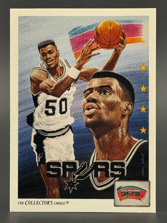 Illustrated David Robinson basketball card showing him shooting and a large portrait with the Spurs logo.