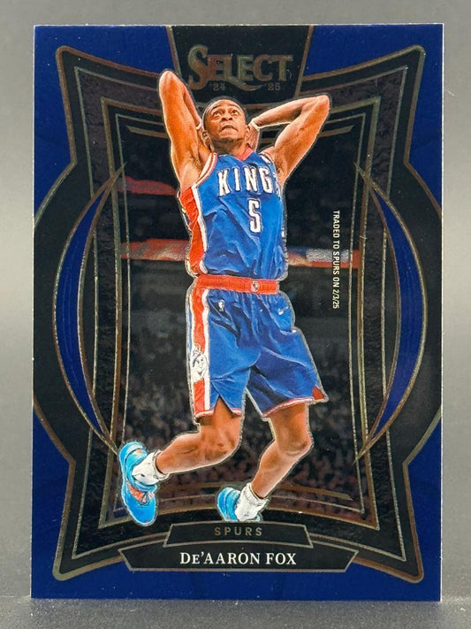 2024-25 Select De'Aaron Fox basketball trading card in a blue and black die-cut design.