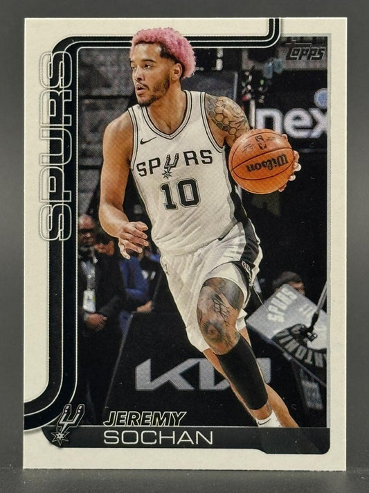 2023-24 Topps Jeremy Sochan San Antonio Spurs basketball card dribbling in white jersey.