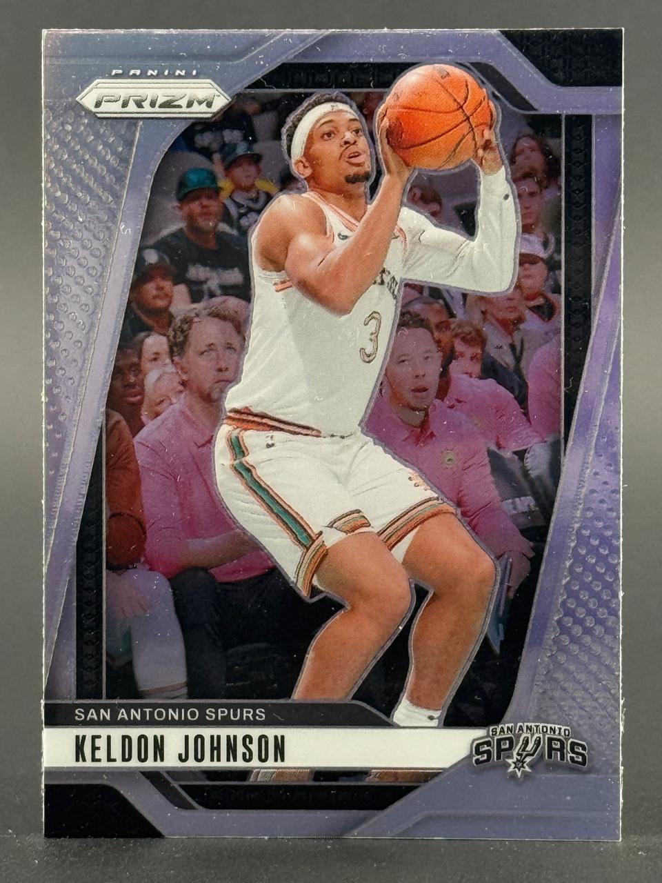 Keldon Johnson San Antonio Spurs trading card, Panini Prizm, holding a basketball.