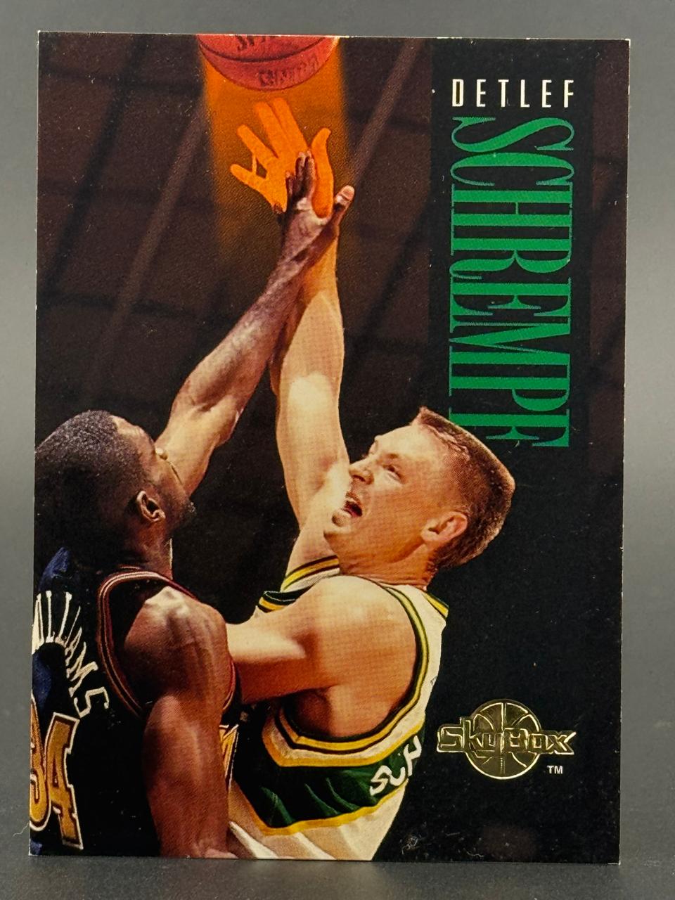 1993-94 SkyBox Detlef Schrempf trading card featuring an action shot of him playing basketball.