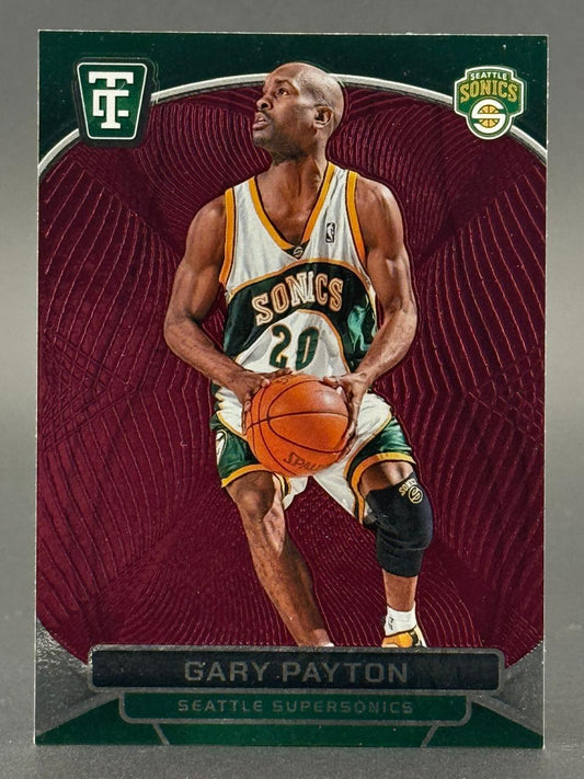 Gary Payton trading card holding a basketball in Seattle Supersonics uniform against a maroon background.