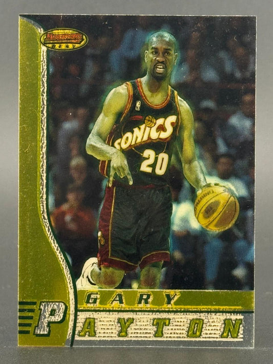 Gary Payton 1990s Bowman's Best basketball card with green border, dribbling in a Sonics uniform.