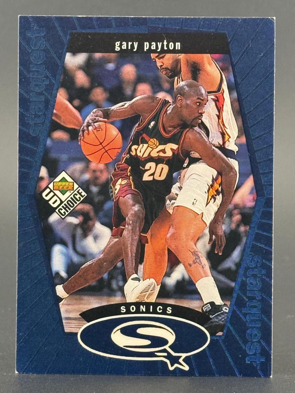 1998-99 UD Choice StarQuest Gary Payton trading card #SQ20, showing Payton dribbling in a Sonics uniform.