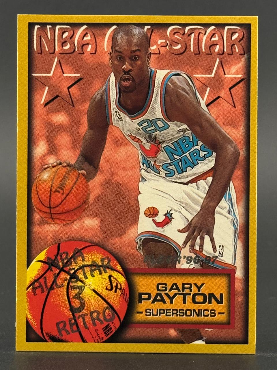 Gary Payton 1996-97 NBA All-Star trading card dribbling a basketball.