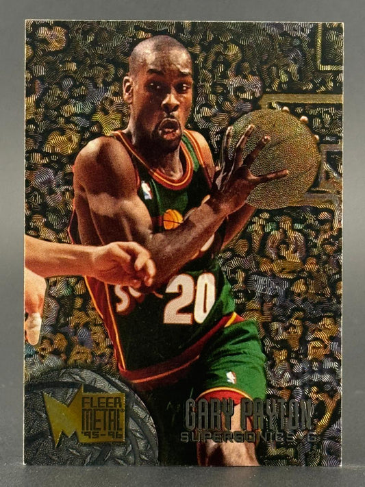 1995-96 Fleer Metal Gary Payton trading card, #6, showing him in a SuperSonics uniform holding a basketball.