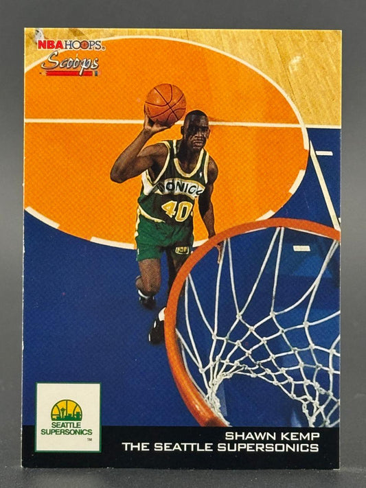 Shawn Kemp 1992-93 NBA Hoops Scoops trading card #NBA, holding a basketball near a hoop.