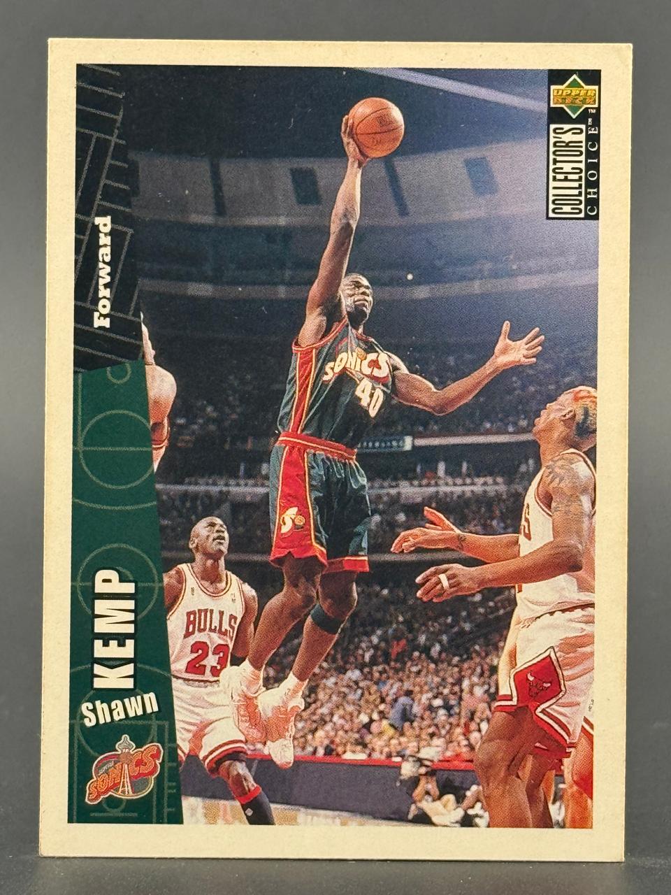 Shawn Kemp 1994 Upper Deck Collector's Choice basketball card, #40, showing Kemp dunking over Michael Jordan.