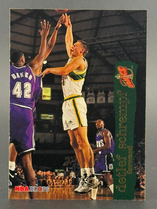 1990s NBA Hoops trading card of Detlef Schrempf in a Seattle SuperSonics uniform shooting a jump shot.