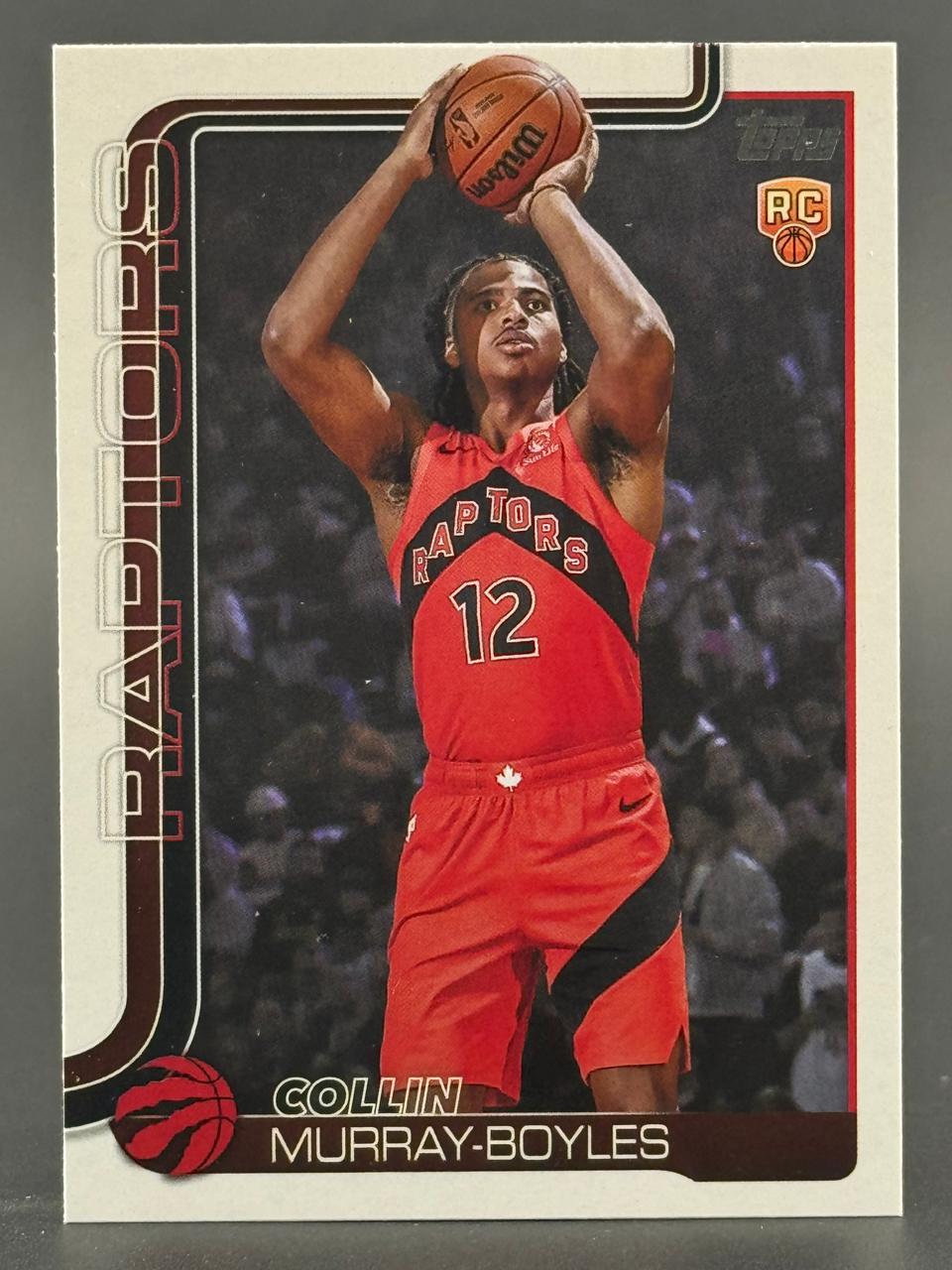 Collin Murray-Boyles Topps basketball trading card, showing him in a red Raptors jersey #12 shooting a basketball.