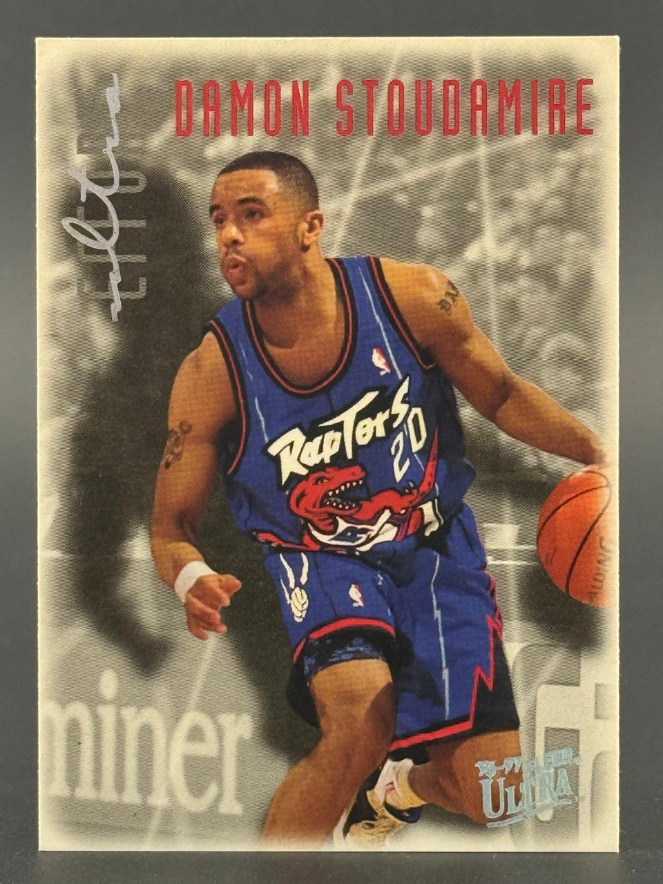 1995-96 Fleer Ultra Damon Stoudamire basketball card dribbling in a Toronto Raptors uniform.