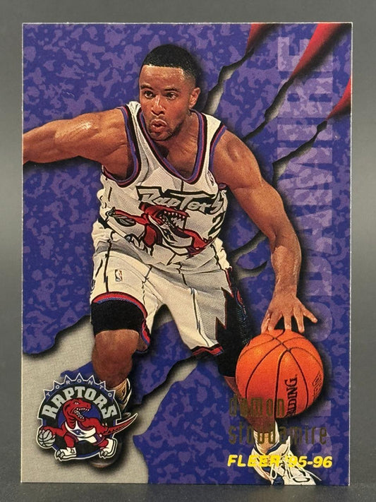 1995-96 Fleer Damon Stoudamire basketball card featuring him dribbling in a Toronto Raptors uniform.