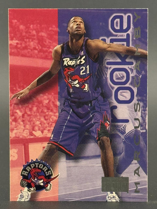 Marcus Camby basketball trading card showing him in a Raptors uniform with "Rookie" on the side.