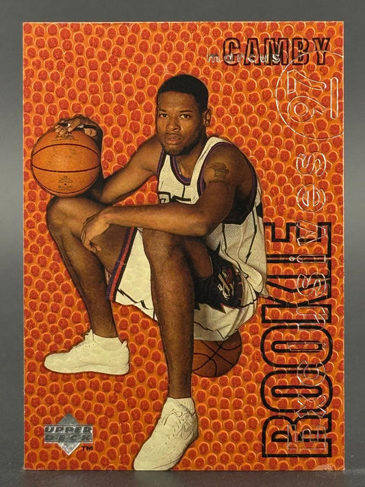 Marcus Camby basketball trading card with an orange textured background.