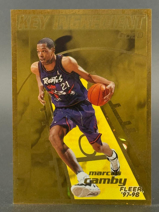 1997-98 Fleer Key Ingredient Gold Marcus Camby trading card.