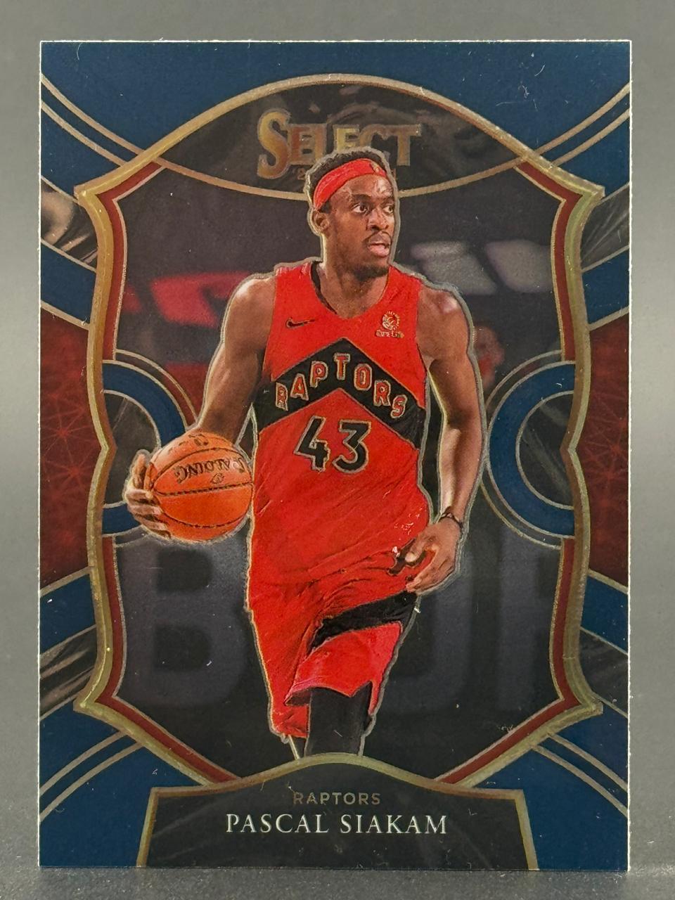 Pascal Siakam 2019-20 Select basketball card, #43, showing him dribbling in a red Raptors uniform.