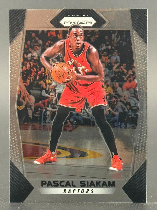 Pascal Siakam basketball card, Panini Prizm, featuring him in a red Raptors uniform holding a basketball.