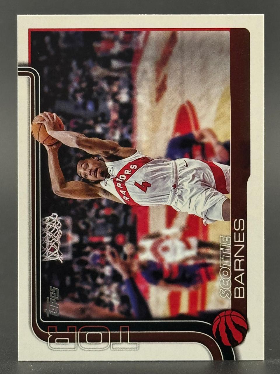 Scottie Barnes Topps basketball card with horizontal photo of him dunking.