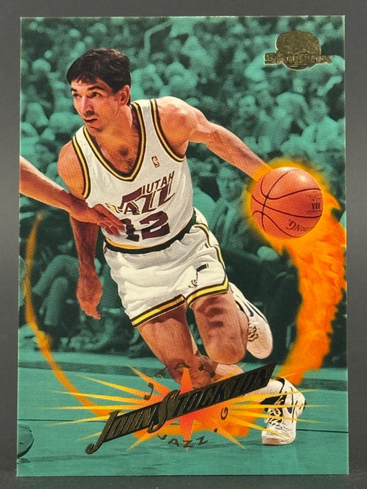 1993 SkyBox John Stockton basketball card showing him dribbling with a fiery orange trail.
