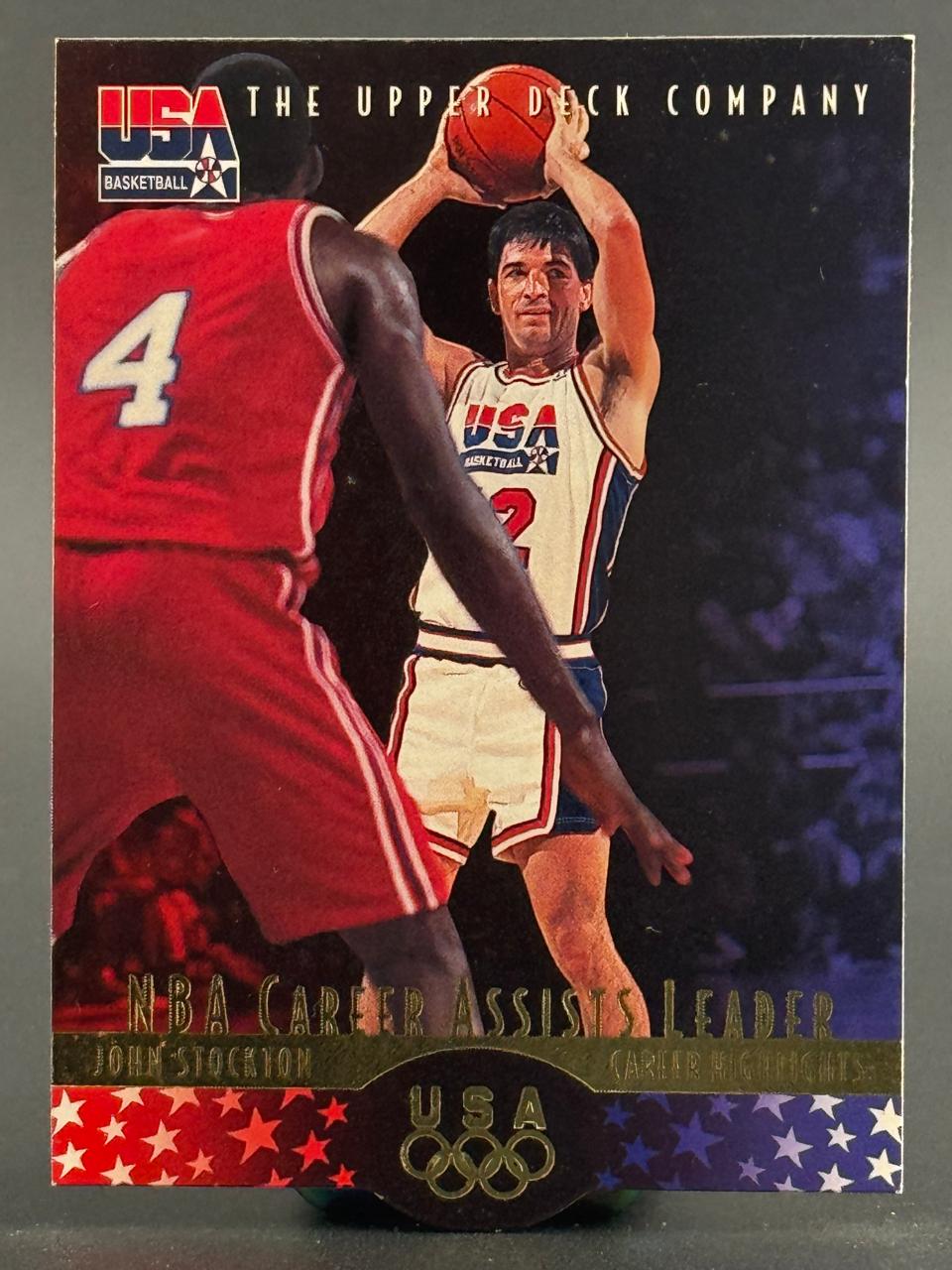 1992 Upper Deck USA Basketball John Stockton card, showing Stockton holding a basketball in a game.