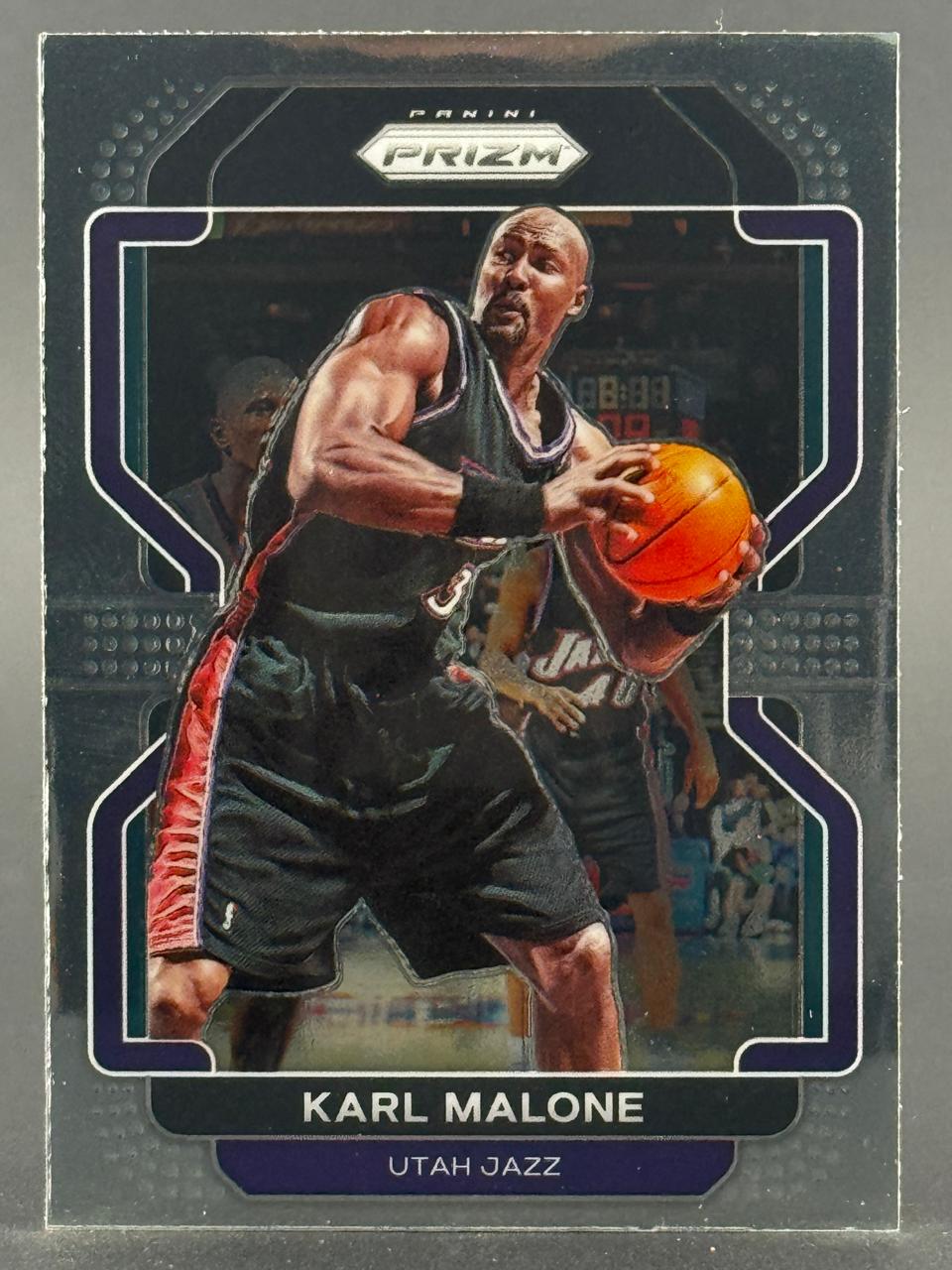 Karl Malone 2012-13 Panini Prizm basketball card holding a basketball.