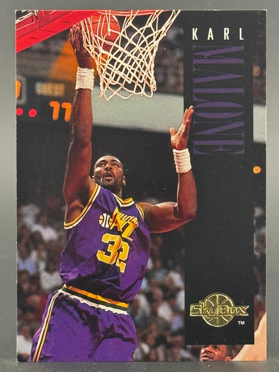 Karl Malone 1991 SkyBox basketball card, #32, dunking.