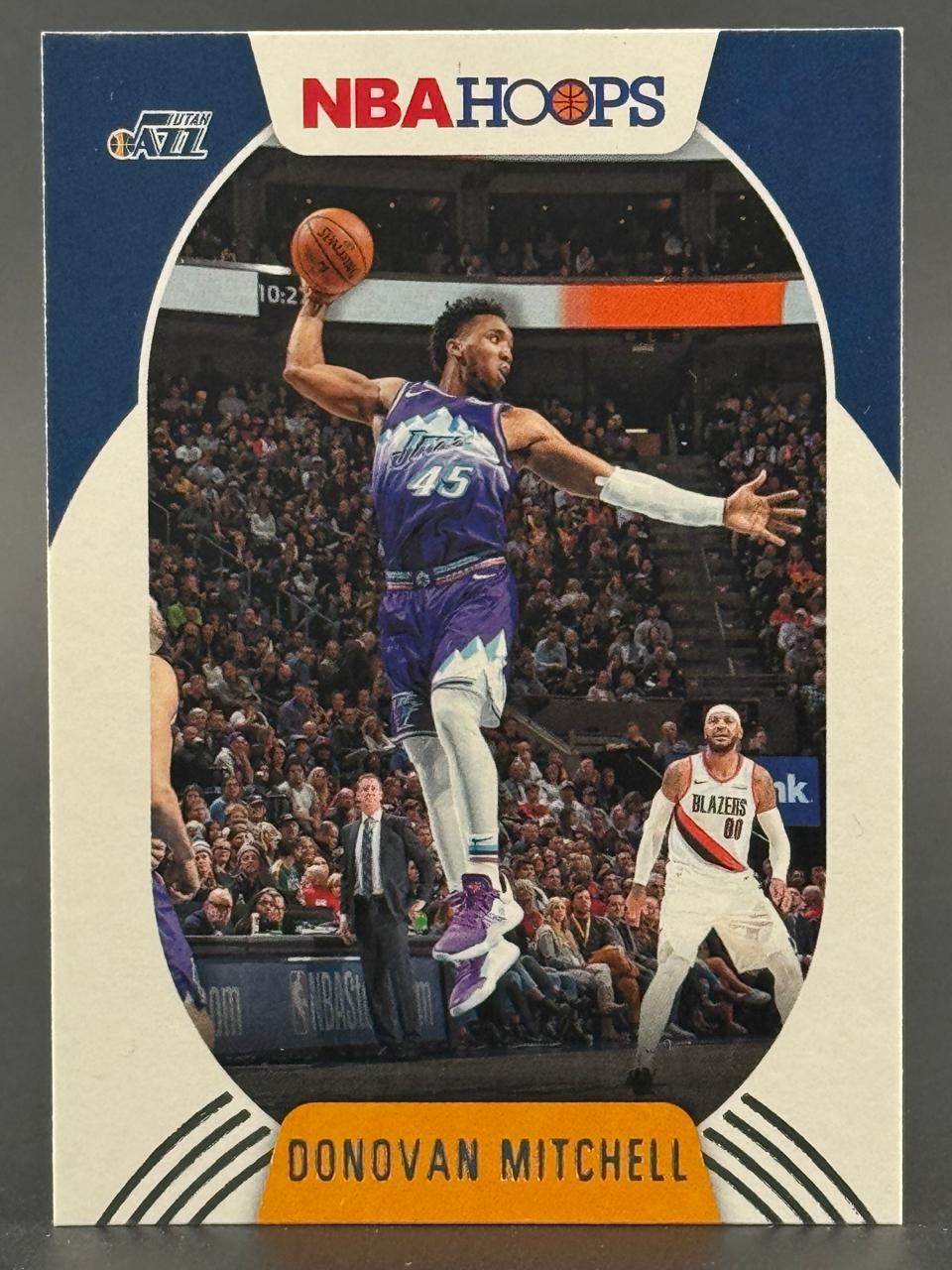 Donovan Mitchell 2018-19 NBA Hoops trading card #125 featuring him dunking in a Utah Jazz uniform.