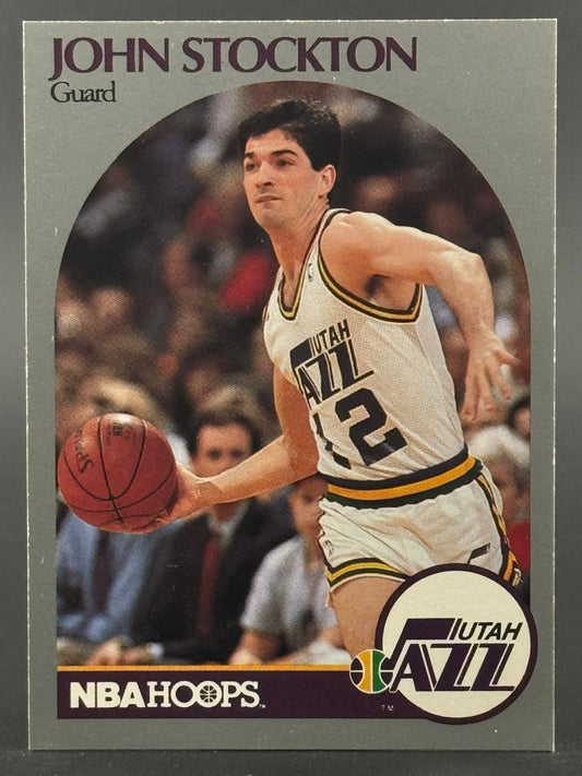 John Stockton trading card from NBA Hoops, showing him dribbling in a Utah Jazz uniform.