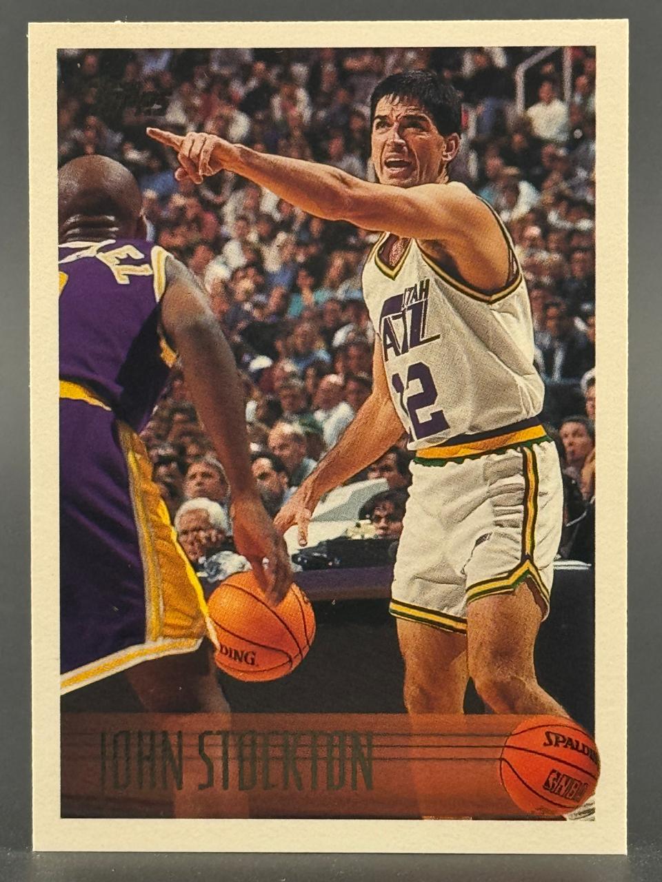 1990-91 Topps John Stockton basketball trading card #114.