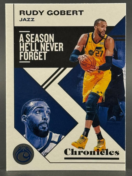 Rudy Gobert 2020-21 Panini Chronicles trading card featuring the Jazz player holding a basketball.