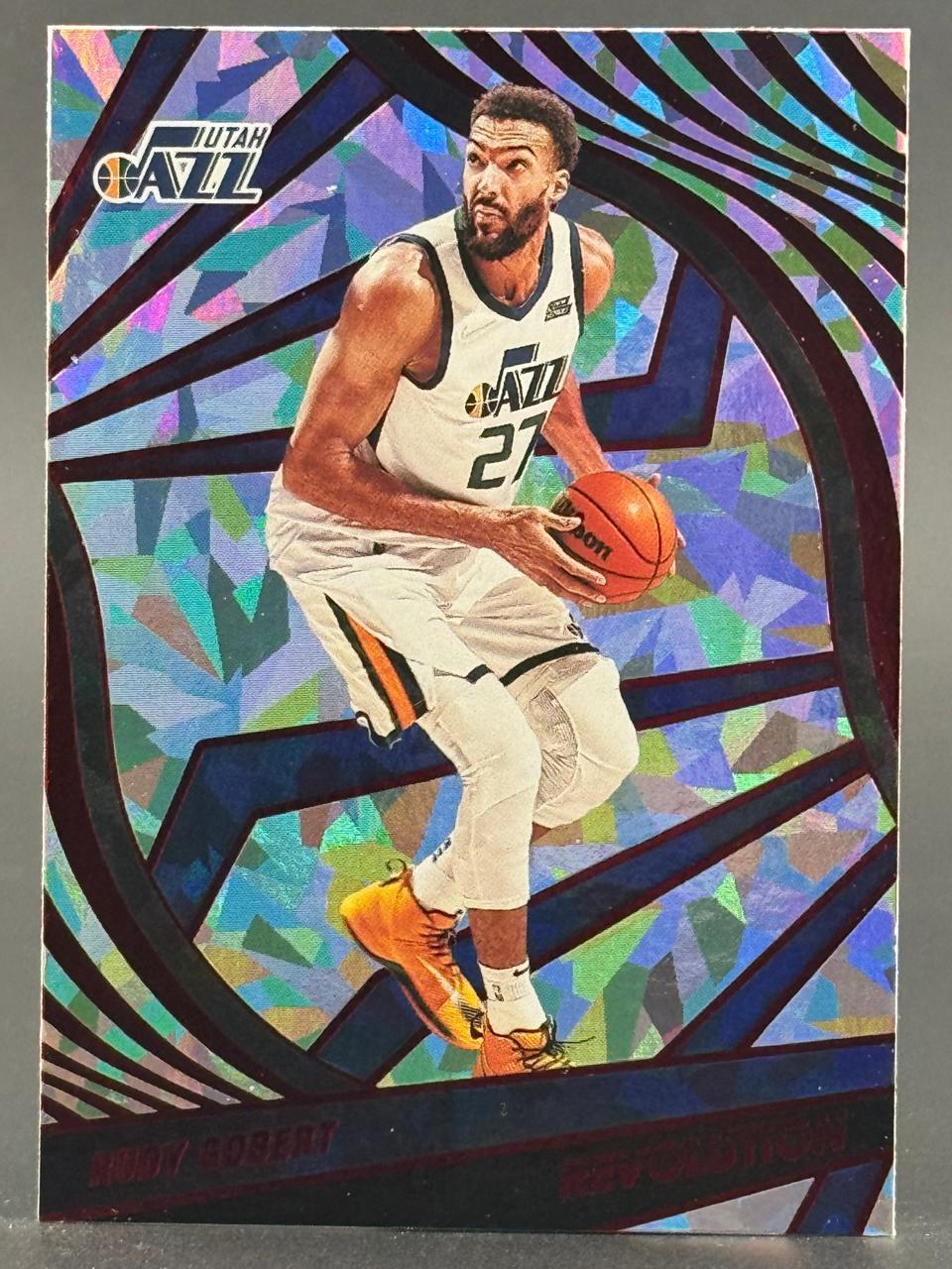 Rudy Gobert Utah Jazz basketball trading card with a geometric holographic background.