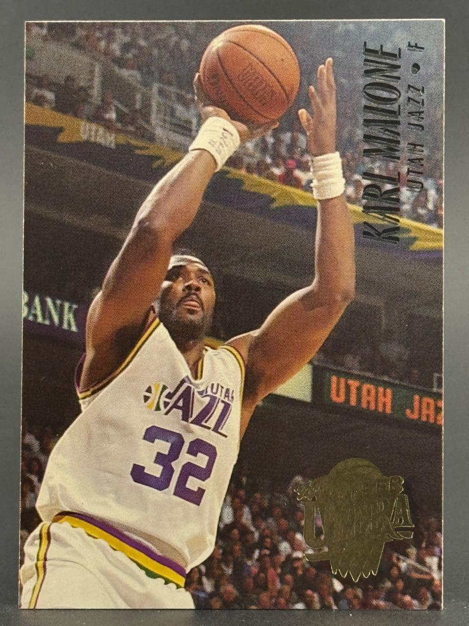 Karl Malone Utah Jazz basketball trading card, showing him shooting a jump shot.