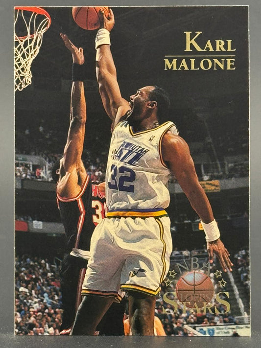 Karl Malone basketball card, Utah Jazz, going up for a dunk against a defender.