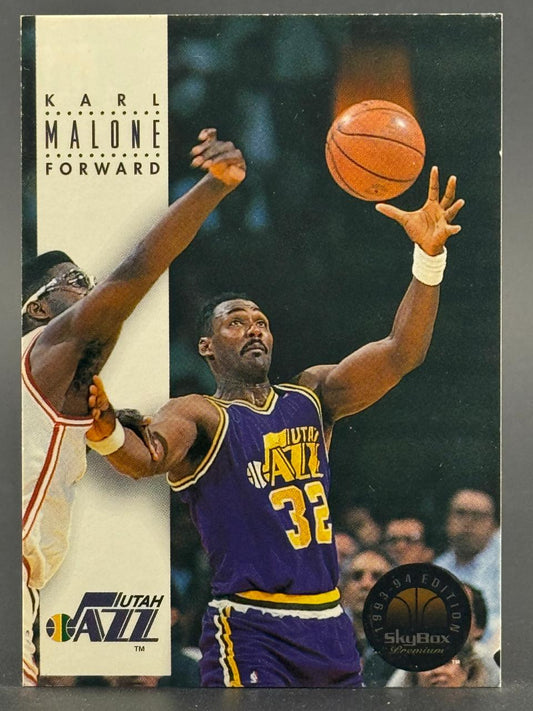 1993-94 SkyBox Premium Karl Malone trading card showing him in a Utah Jazz uniform shooting a basketball.