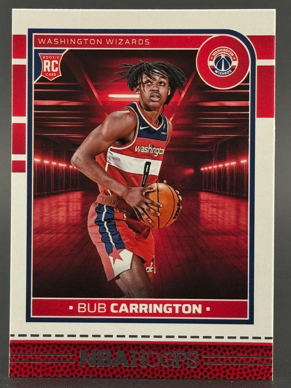 Bub Carrington rookie trading card from NBA Hoops featuring the Washington Wizards player holding a basketball.