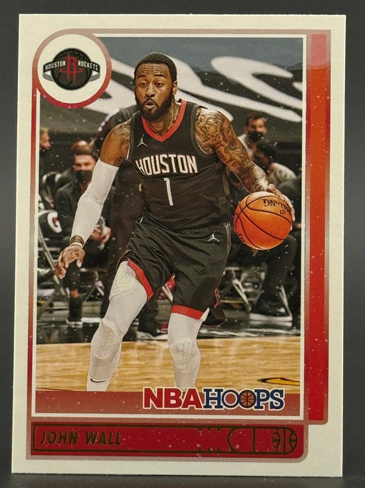 John Wall 2020-21 NBA Hoops basketball card dribbling in a Houston Rockets uniform.
