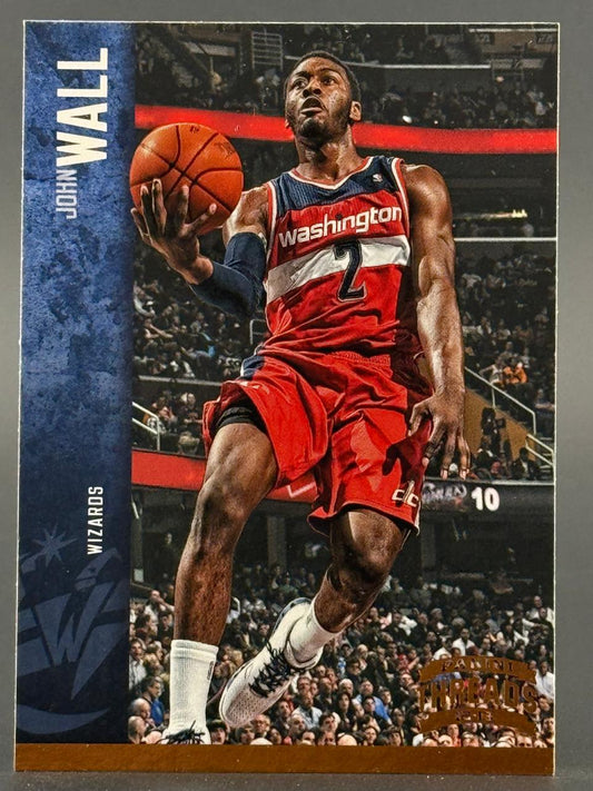2012-13 Panini Threads John Wall basketball card featuring Wall in a red Washington Wizards uniform holding a ball.