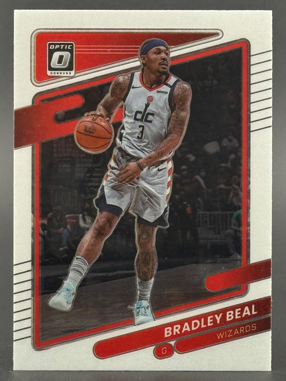 Bradley Beal trading card, Donruss Optic, showing Beal in a Washington Wizards uniform dribbling a basketball.