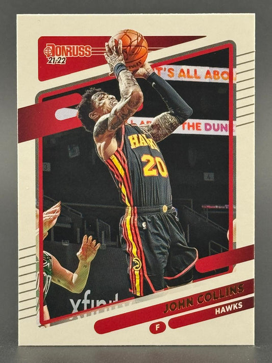 2021-22 Donruss John Collins basketball card showing him shooting a basketball.