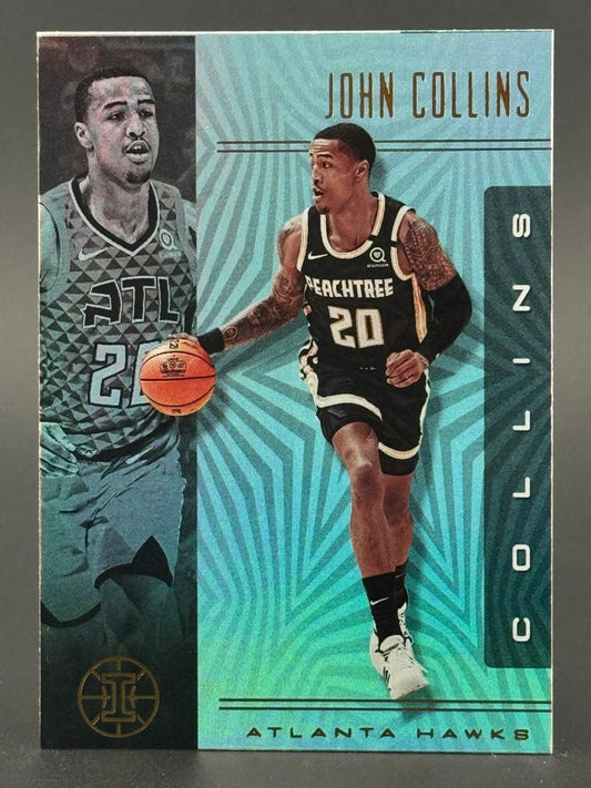 John Collins basketball trading card featuring him dribbling for the Atlanta Hawks.
