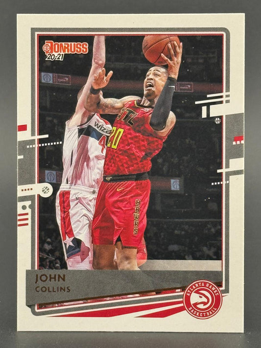 2020-21 Donruss John Collins trading card featuring him in a red Atlanta Hawks uniform.