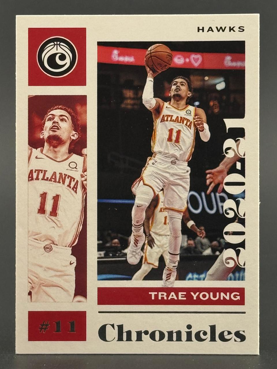 2020-21 Panini Chronicles Trae Young basketball card showing him in an Atlanta Hawks uniform.