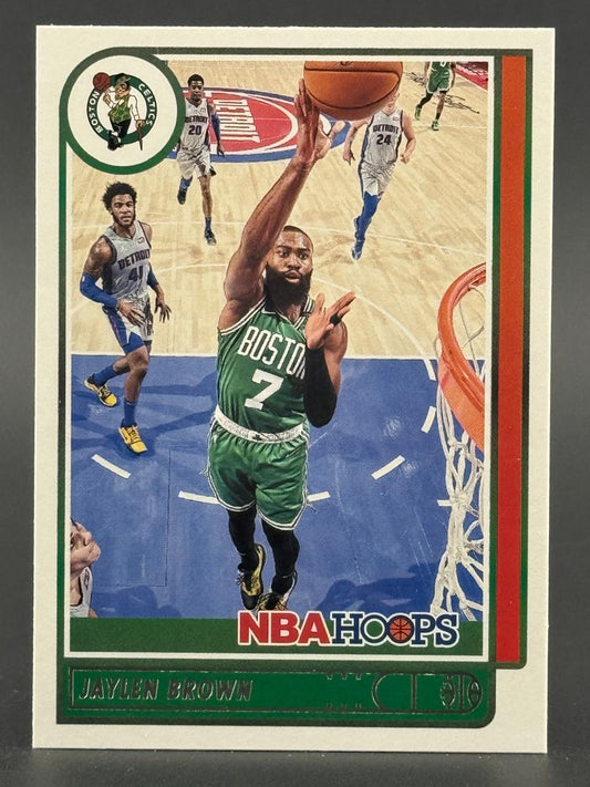 Jaylen Brown trading card, NBA Hoops, showing him driving to the basket in a Boston Celtics uniform.