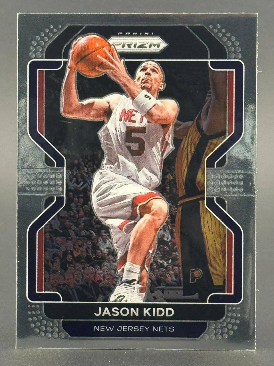 Jason Kidd Panini Prizm trading card, showing him in a New Jersey Nets uniform holding a basketball.