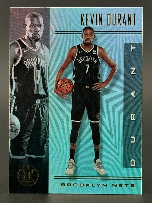 Trading card of Kevin Durant in a black Brooklyn Nets jersey holding a basketball, against a blue background.