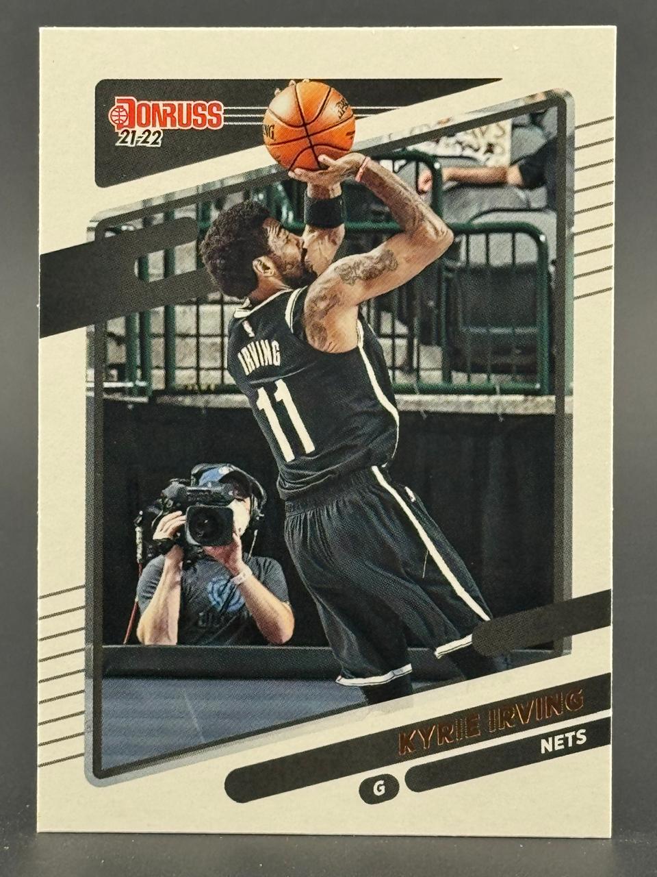 21-22 Donruss Kyrie Irving Nets basketball card shooting a jump shot.